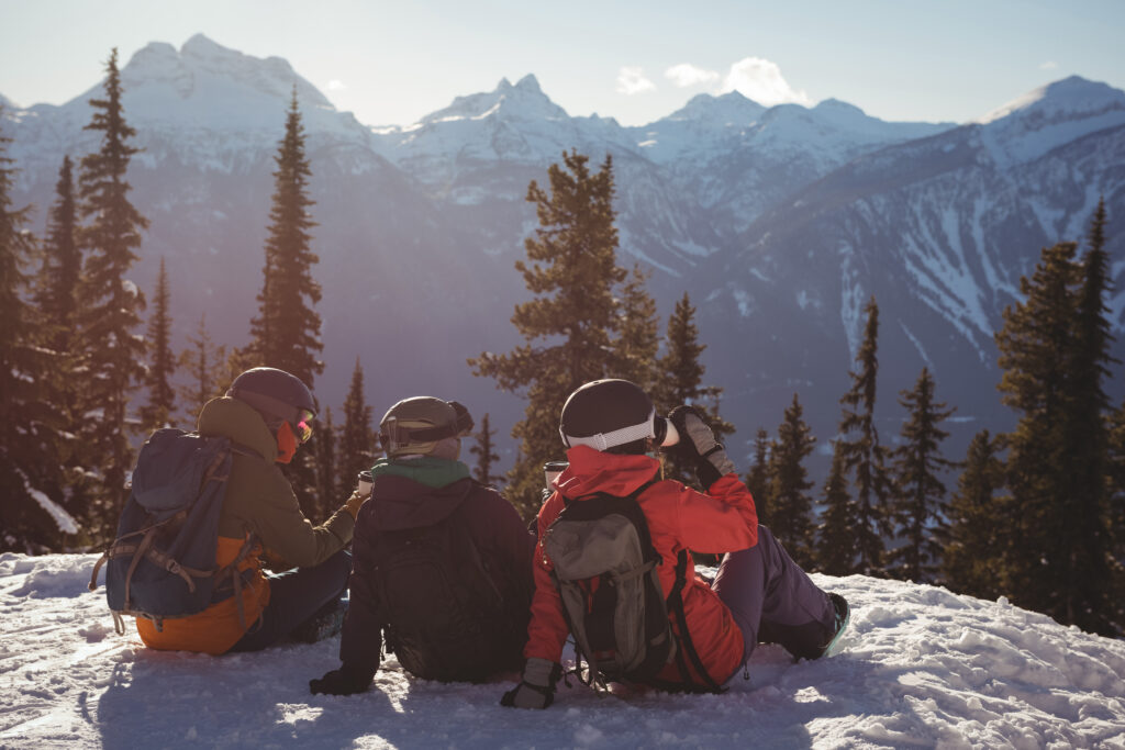 Family Friendly Winter Adventures In The Colorado Rockies 1 Three skiers relaxing snow covered mountain