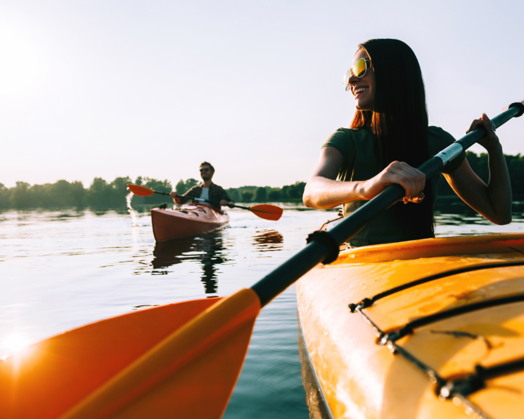 The &Quot;Mud Season&Quot; Manifesto: Why Spring Is Colorado’s Best-Kept Secret 3 Two travelers kayaking on a calm river in colorado during a sunny spring afternoon.