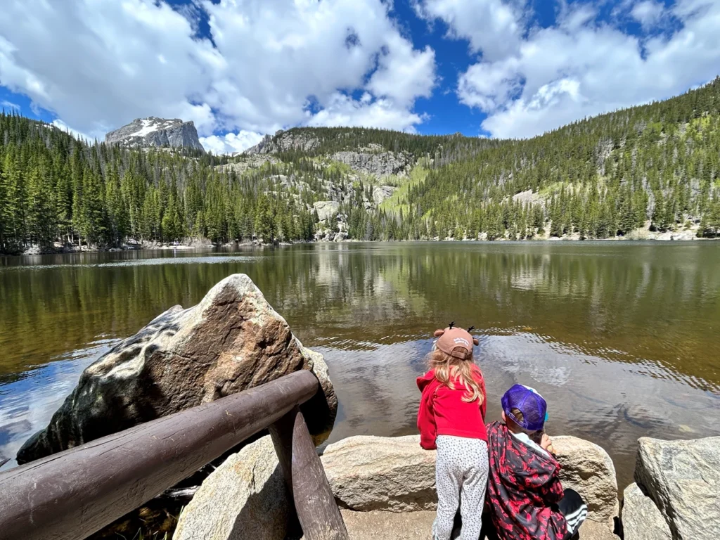 Rocky Mountain National Park Road Trip From Denver: A Family Guide 4 Bear lake with jr rangers looking out