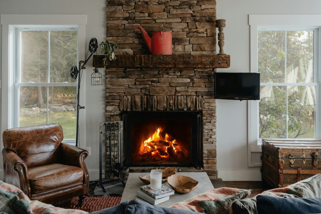 Cozy living room with a stone fireplace in a colorado fall rental
