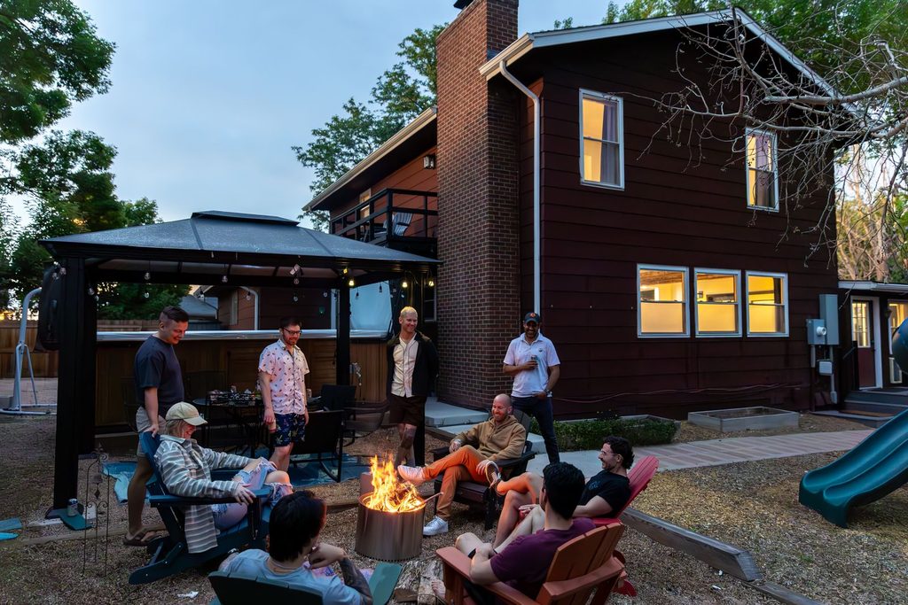 Pet-friendly cabins near denver- friends gathered by the firepit at the arvada social, a pet-friendly group rental in arvada